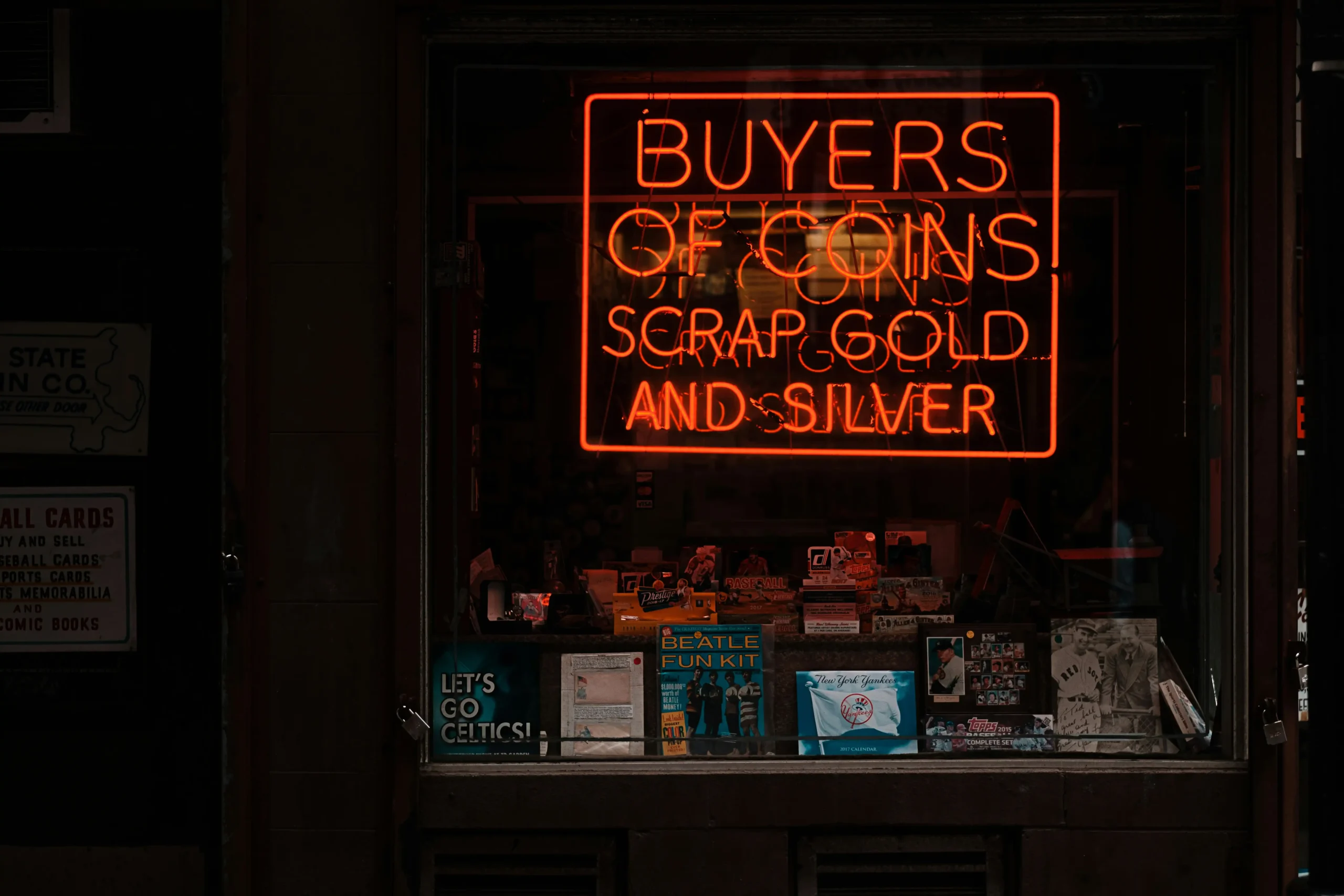 Neon pawn shop sign lit up in the dark