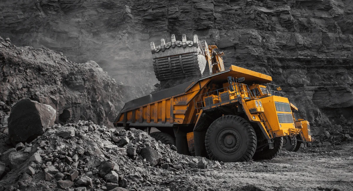 A dump truck picks up loads of ore