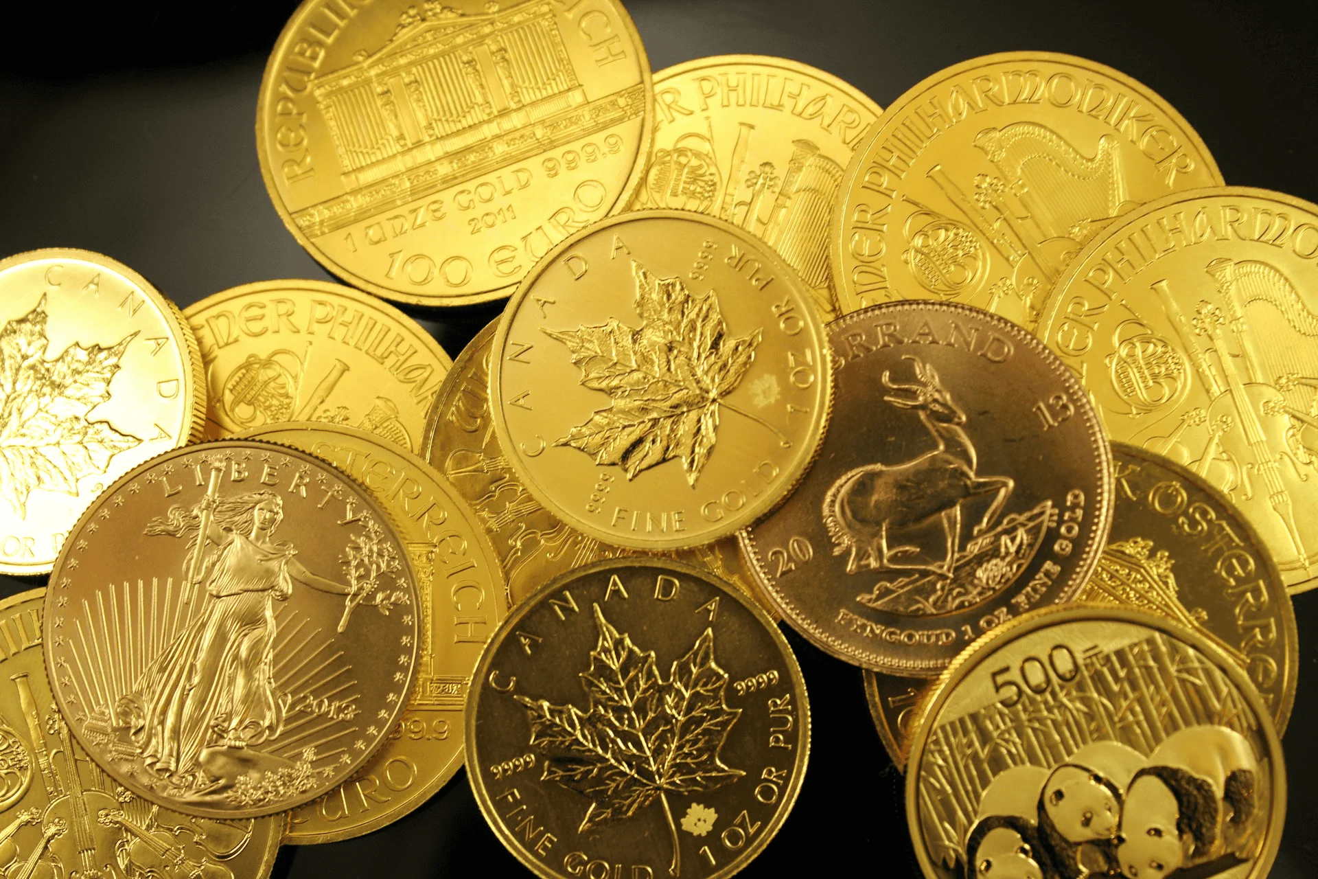 Gold coins lay in a pile on a table