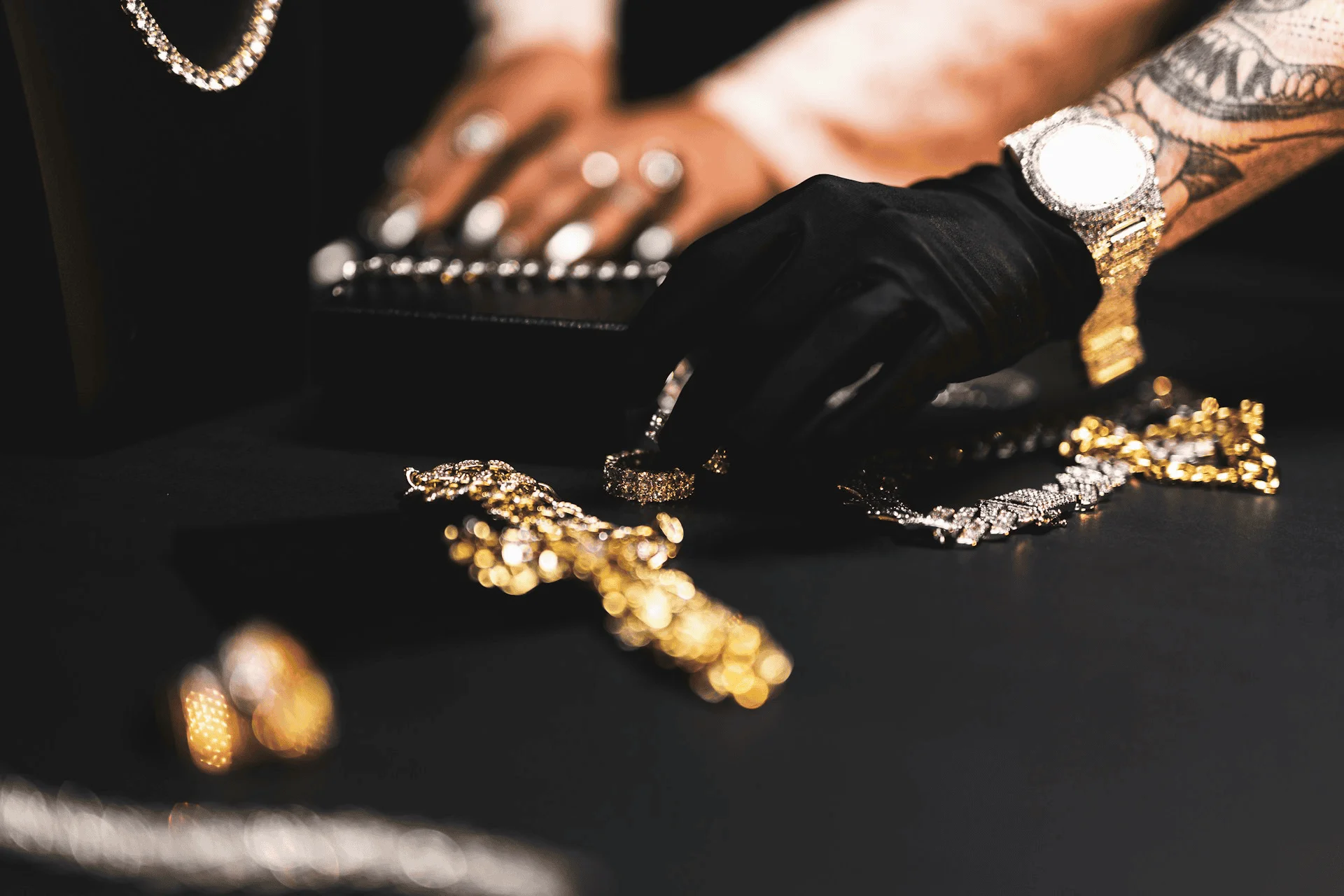 A pawn shop examines various gold pieces