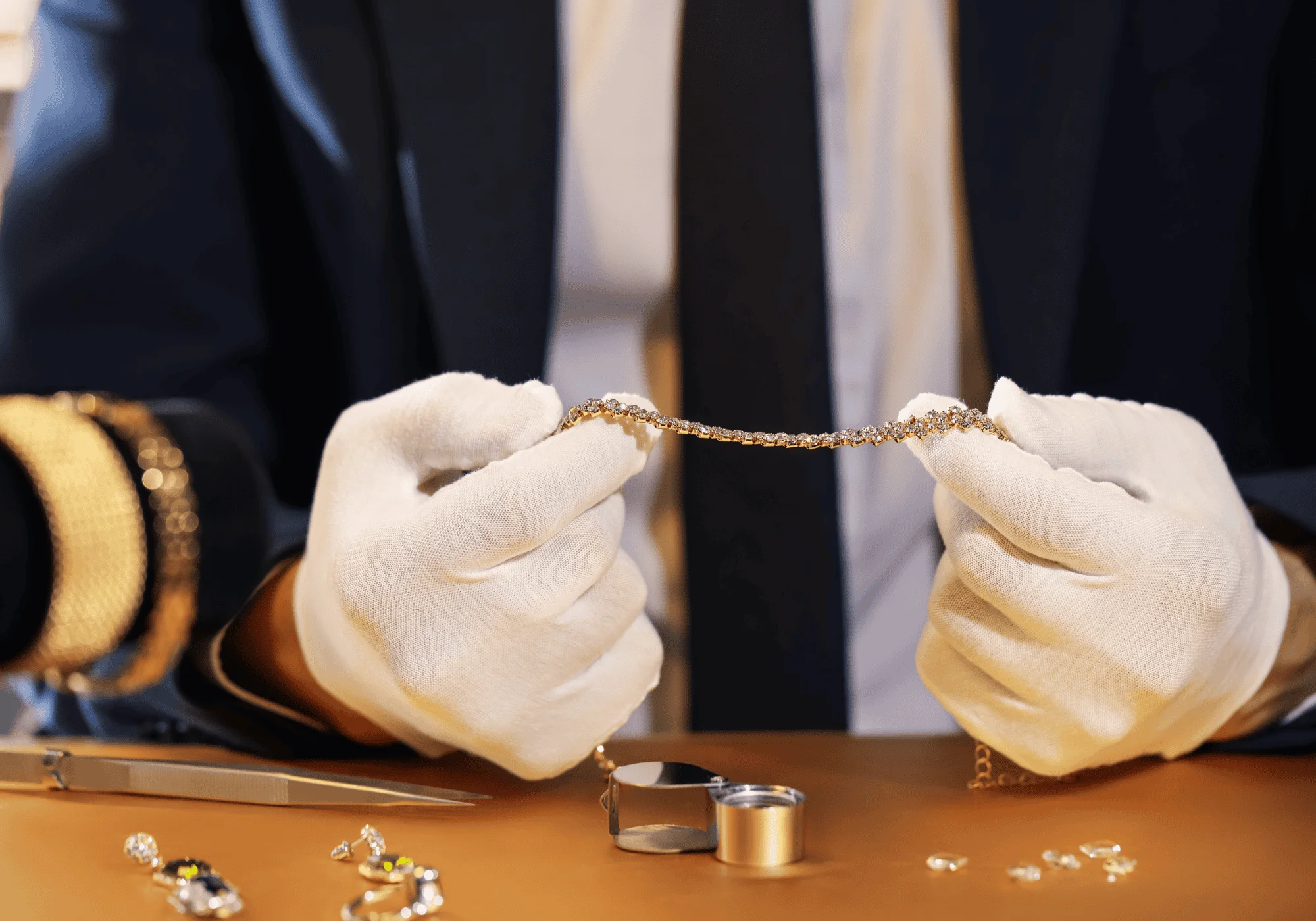 A man examines jewelry during the authentication process