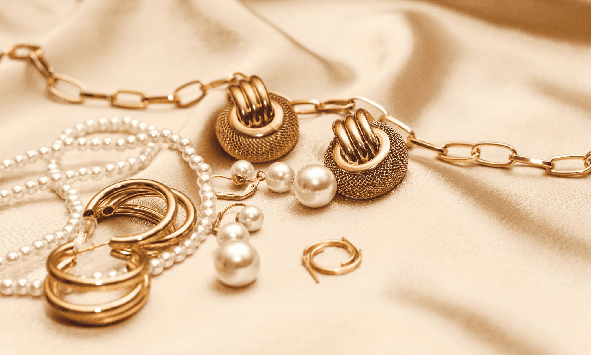 various jewelry spread out on a table