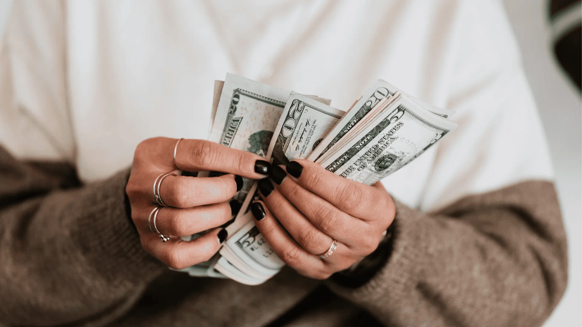 A woman counts money