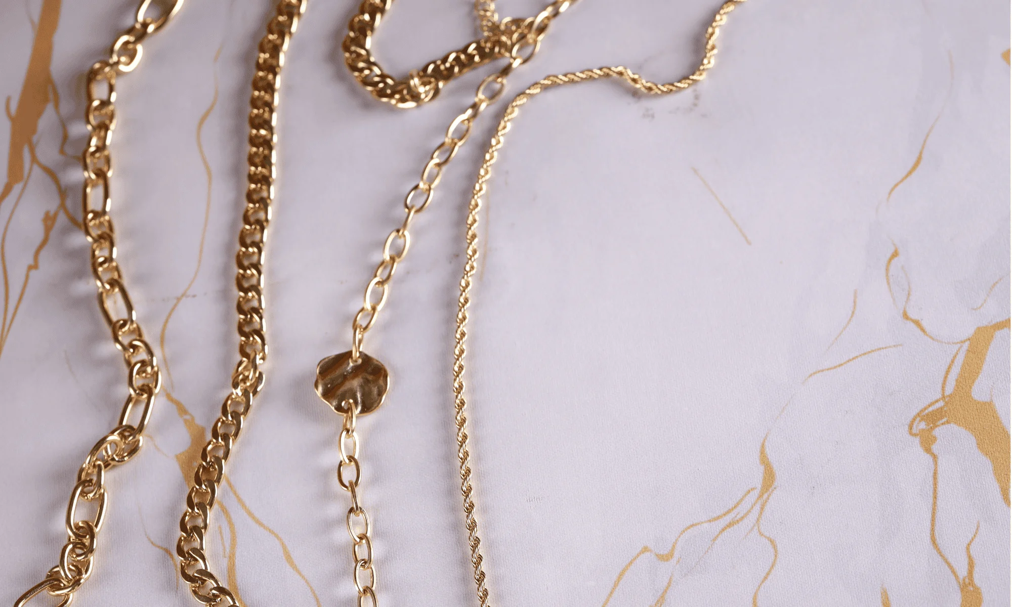 gold chains on a table