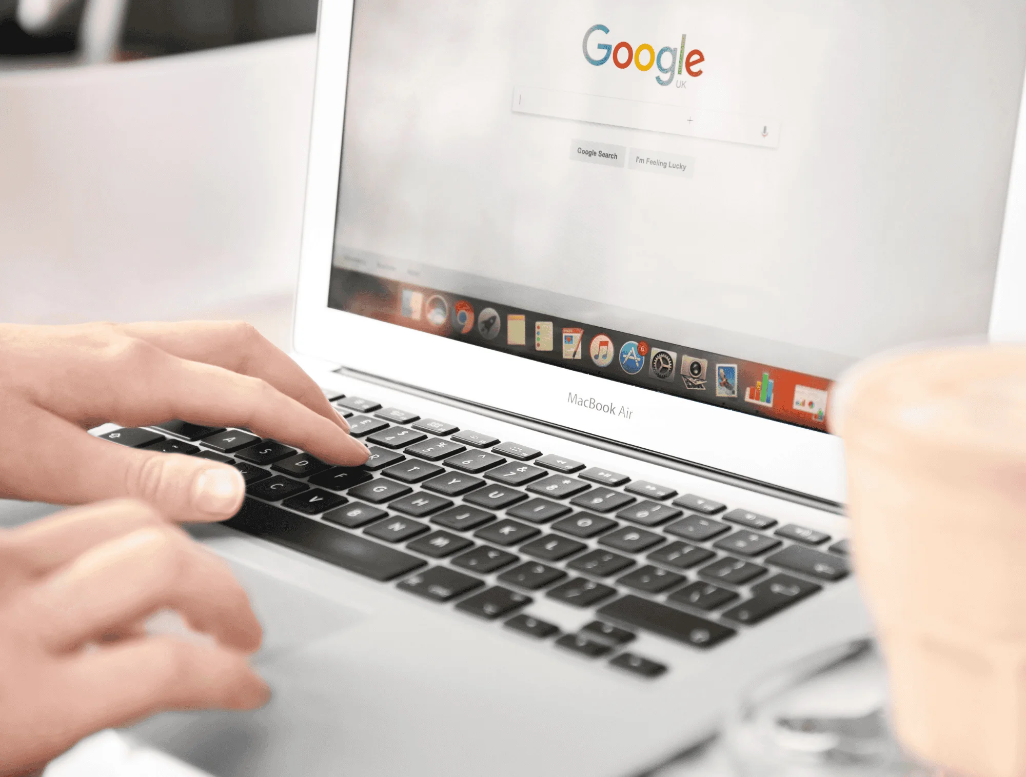 A person turns to google to research gold buyers