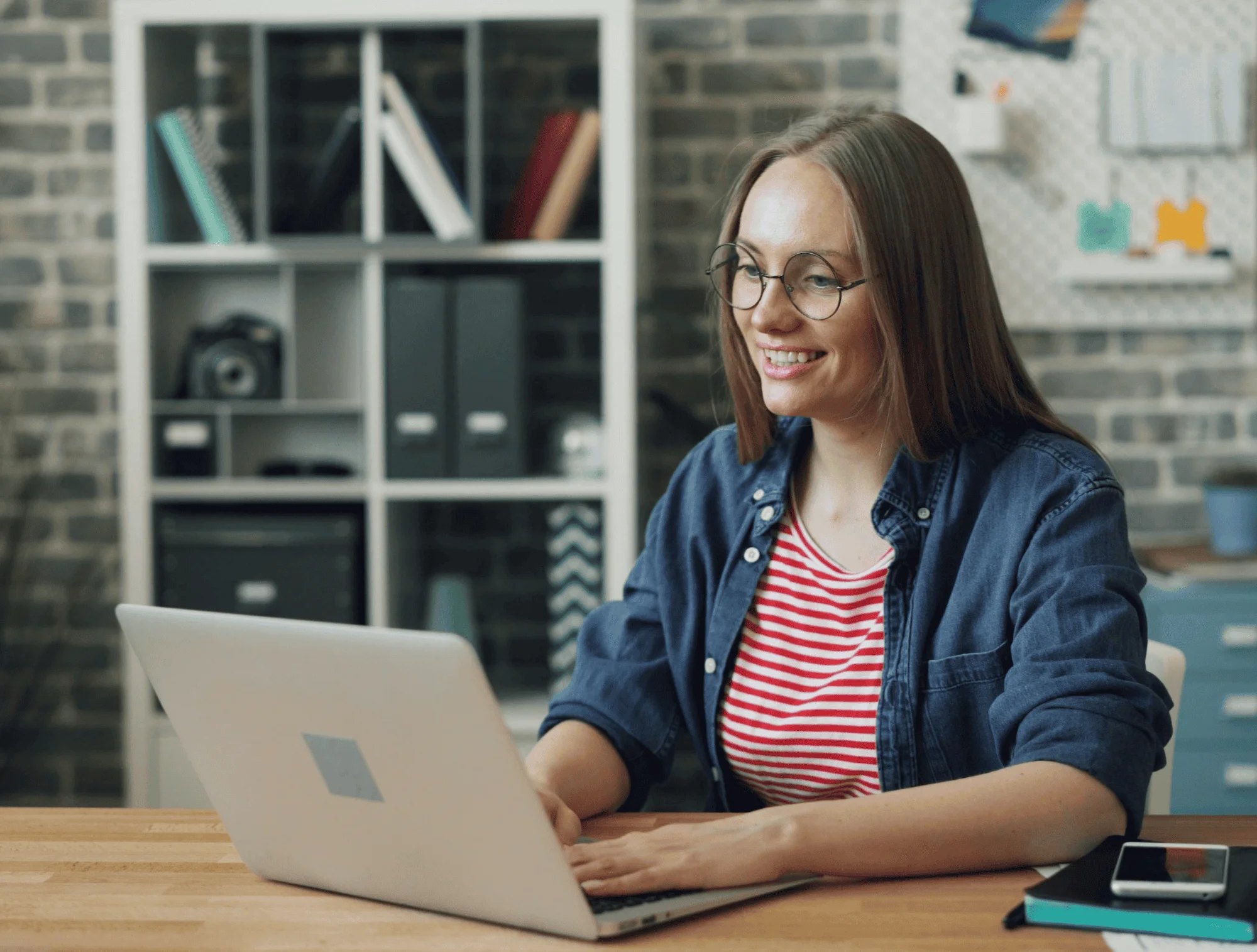 a woman sits at her computer
