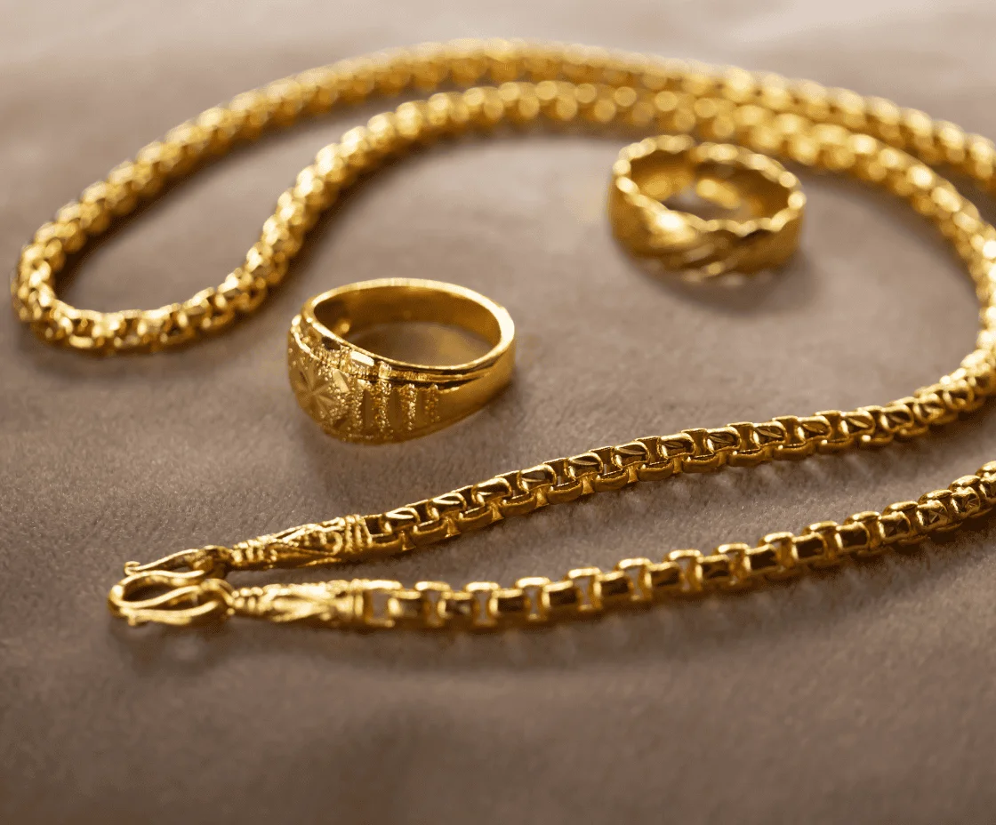 two gold rings and necklace
