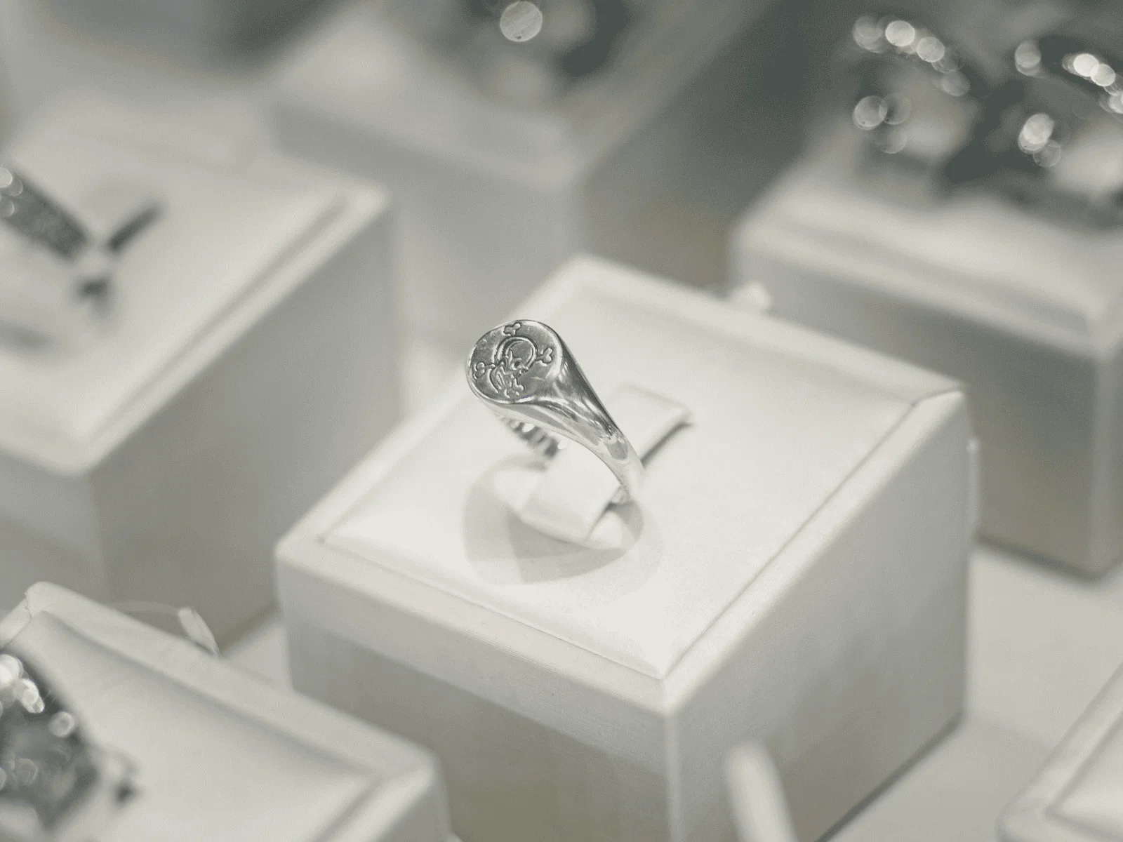 white gold ring in a jewelry display case
