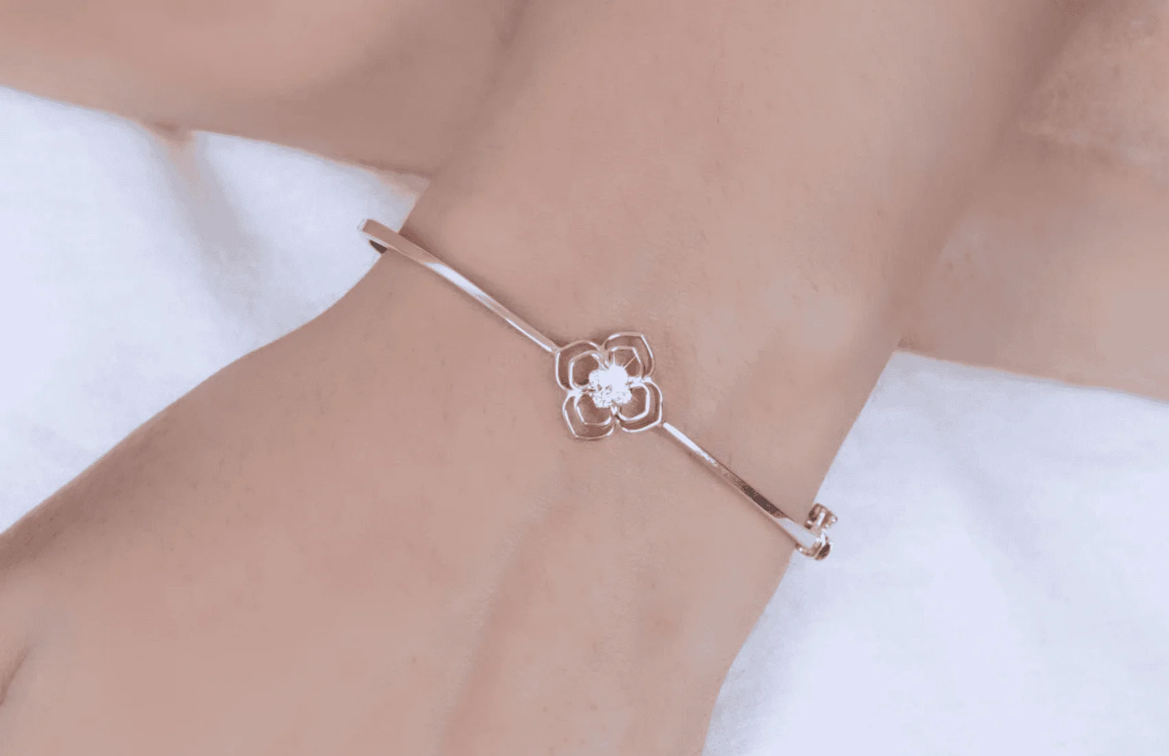 woman wearing rose gold bracelet