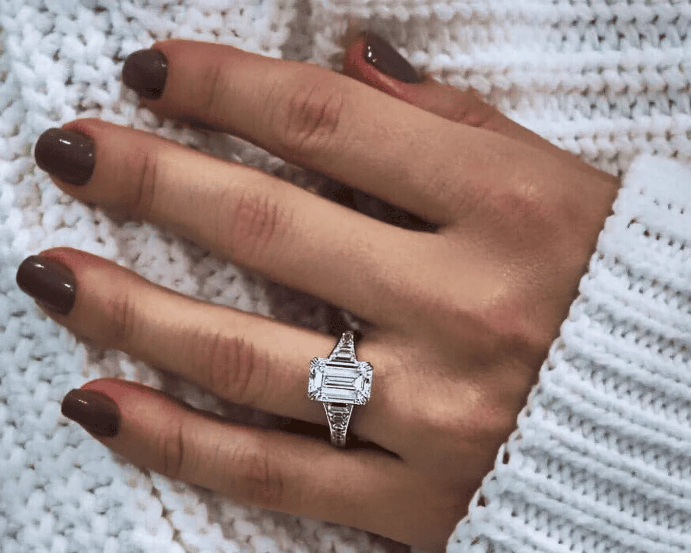 white sweater with ring