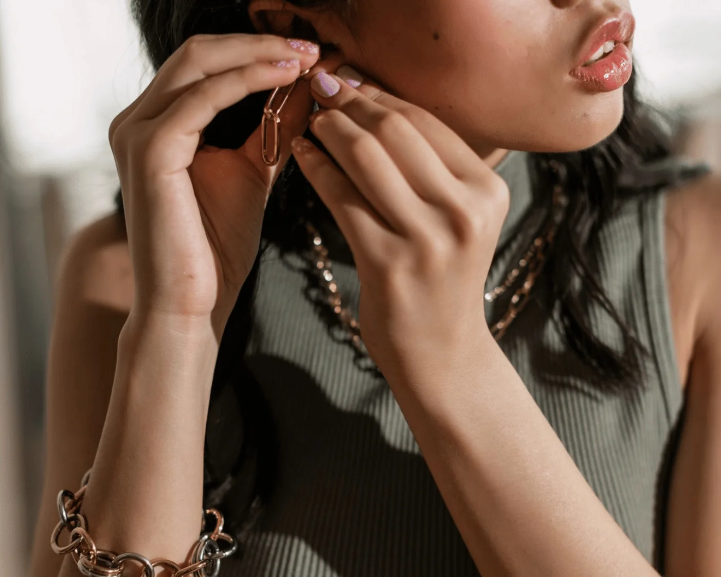 putting on earrings