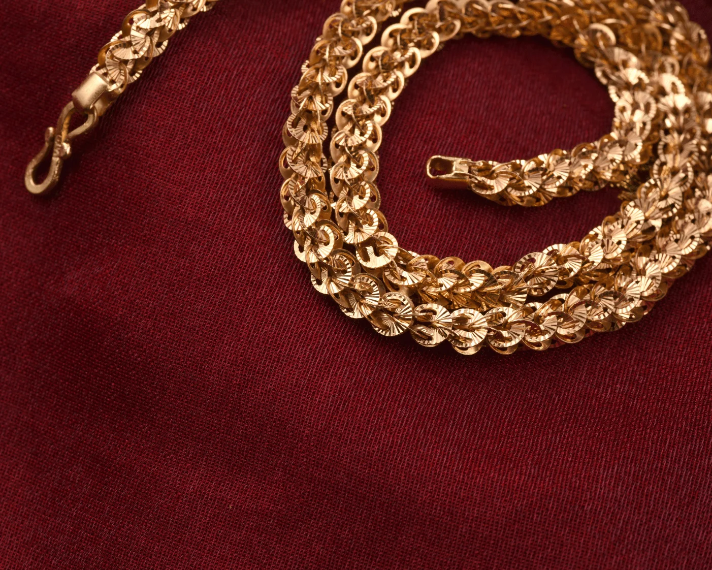gold chain on red
